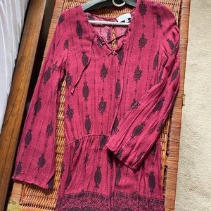 Long sleeved maroon romper with black pattern